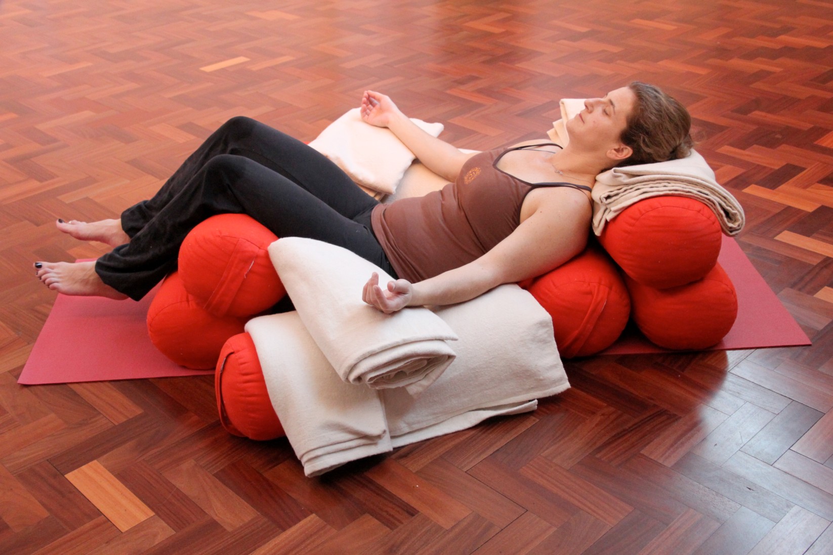 woman on matt doing relaxing yoga